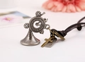 Steampunk gear clock necklace with bronze cross and engraved tag on leather cord - Horn