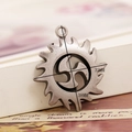 Detailed view of antique silver alloy gear pendant with triskelion symbol and dimensions - Antique Silver