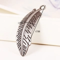 Detailed macro view of an alloy feather pendant with 47mm height for DIY jewelry making - Antique Bronze (B)