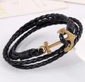 Multilayer black leather braided bracelet with a golden anchor-shaped clasp detail - Black