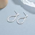 S925 sterling silver twisted teardrop stud earrings with a sparkling textured finish - 925 Silver / Silver