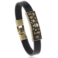 Bracciale vintage in pelle nera con teschi in rilievo bronzo antico e chiusura metallica - Nero