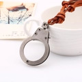 Retro adjustable leather rope necklace with an antique silver finish handcuff pendant - Tan