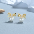 Elegant gold bow earrings with white pearl drops and shimmering zircon accents - 925 Sterling Silver / Gold