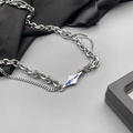 Collana multistrato in acciaio al titanio con pendente lava blu e pietra zircone - Collana Lava Intrecciata