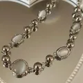 Collana minimalista con pietre di luna e sfere in metallo argentato per uomo e donna - Stile Opale Argento