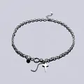 Collana con ciondolo a stella e sfera in argento con catena a maglie e nappa - Stile Stella Argentata