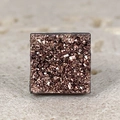 Macro shot of square rose gold druzy crystal with glittering texture and metal base - Champagne Square Druzy