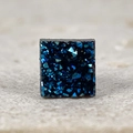 Close-up of square magnetic earring with deep blue druzy crystal texture and matte finish - Blue Square Druzy