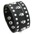 Punk black leather wide bracelet featuring silver skull charms and metal studs - Black