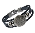 Macro detail of men's multi-layer woven leather bracelet with vintage skull clasp buckle - Round Avatar