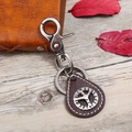 Retro punk keychain with leather pendant, metal hook and peace sign on wood background - Dark Brown