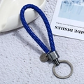 Detail of deep blue braided PU leather keychain with antique silver metal ring and circular tag - Single OPP Bag Packaging / Brushed Silver + Blue