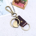 Vintage bronze alloy bird pendant keychain with genuine brown leather strap for men - Brown
