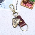 Retro genuine leather keychain with bronze shield pendant and metal carabiner clasp - Brown