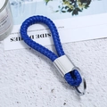 Royal blue braided leather keychain with silver metal ring on a minimalist desk background - Silver Tone + Blue Rope