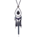 Detailed view of bohemian long necklace featuring dreamcatcher design and purple stone charms - Gray