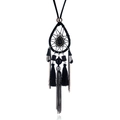 Detail of bohemian dreamcatcher necklace featuring black beadwork and silk tassels - Black