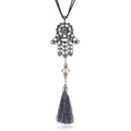 Detail of silver Hamsa Hand pendant with grey rhinestones and long silk tassel - Gray