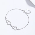 Elegantes Armband aus 925er Sterlingsilber mit hohlen Wu Lou Anhängern und Zirkon - Weißgold