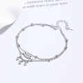 Elegante bracciale a doppio strato in argento 925 con ciondolo lucchetto Ruyi su fondo bianco - Oro Bianco