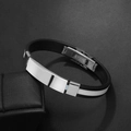 Detail of black silicone men's bracelet with polished stainless steel plate and folding clasp - White