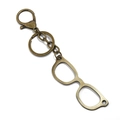 Detail view of retro bronze alloy keychain with vintage glasses frame charm and lobster clasp - Glasses