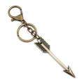 Macro detail of antique bronze arrow pendant with feather texture and metal clasp - Arrow