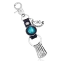 Detail of a Leo constellation leather keychain with a moon bear charm and silver hooks - Single Pack / Leo
