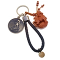 Detailed view of Virgo zodiac metal pendant with leather braided keychain and wooden charm - Single OPP Bag Packaging / Virgo