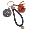 Macro shot of Aquarius zodiac medal and carved wooden horse pendant on leather keychain - Single OPP Bag Packaging / Aquarius