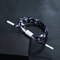 Macro view of purple and white braided cord bracelet with adjustable slide buckle and logo - Marble Pattern with White Buckle