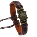 Vintage braided leather bracelet featuring a bronze wolf head charm in punk style - Brown