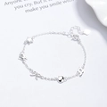 925 zilveren armband met ster-, strik- en muzieknoot-bedeltjes en hartvormige sluiting - Zilver