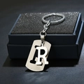 Detail of silver letter R keychain with brushed metal texture and double-layer design - Letter R / Silver