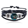 Detailed close-up of woven leather bracelet featuring Pisces zodiac sign and silver metal beads - Pisces