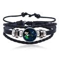 Detailed view of Sagittarius leather braided bracelet with luminous glass dome and metal beads - Sagittarius
