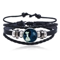 Macro detail of Virgo zodiac leather bracelet featuring luminous glass cabochon and woven bands - Virgo
