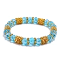 Minimalist elastic beaded bracelet with light blue crystal beads and gold textured accents - Light Blue