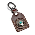 Handcrafted brown leather keychain with ethnic silver disk and turquoise bead detail - Brown