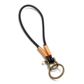 Portachiavi auto minimalista in pelle nera con avvolgimento arancione e fibbia - Marrone