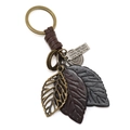 Porte-clés vintage en cuir avec feuilles et anneau en bronze et pendentif gravé - Noir + Marron Foncé