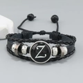 Detail of multi-layer black leather bracelet with letter Z charm and adjustable cord - Letter Z