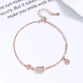 Elegante bracciale in argento 925 oro rosa con cilindro scintillante e ciondoli a moneta - Argento 925 / Oro rosa
