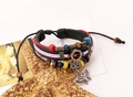 Detail of layered leather bracelet with colorful beads and vintage silver butterfly charm - Black