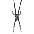 Western vintage bolo tie featuring an antique silver bull skull pendant on black braided cord - Antique Silver