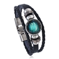 Close-up of Virgo zodiac leather bracelet with glass cabochon and metal clasp - Virgo
