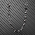 Close-up of vintage gothic skull wallet chain with heavy metal links and lobster clasp - Antique Silver