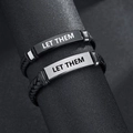 Close-up of woven leather bracelets with engraved metal plates reading LET THEM - Pattern 8-LET THEM (Silver Plate)