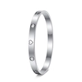 Close-up of silver titanium steel bangle with hollow hearts and sparkling zircons - Silver